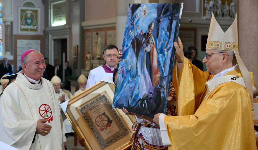 León XIV en la basílica de San Agustín con un cuadro del santo.
